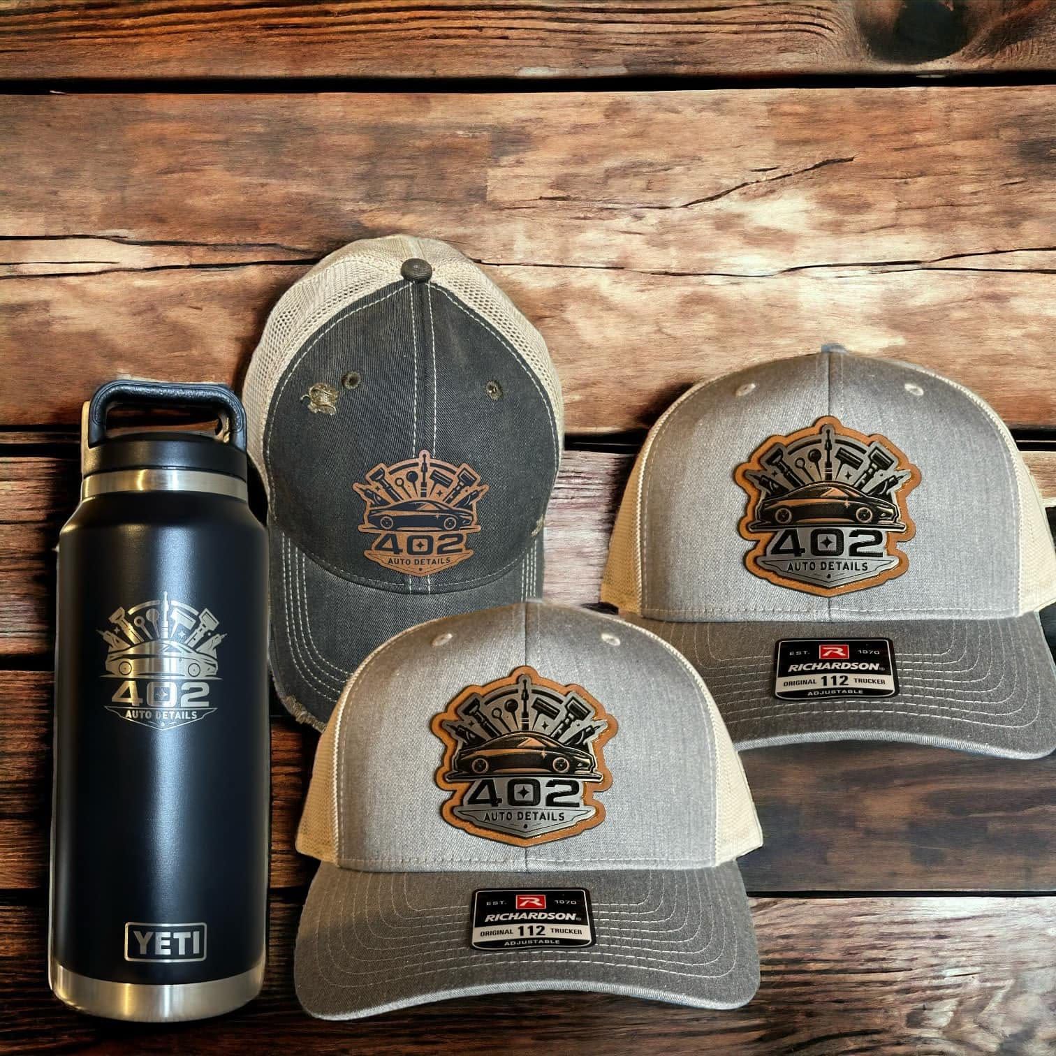 Three trucker hats with engraved leatherette 402 Auto Details patches