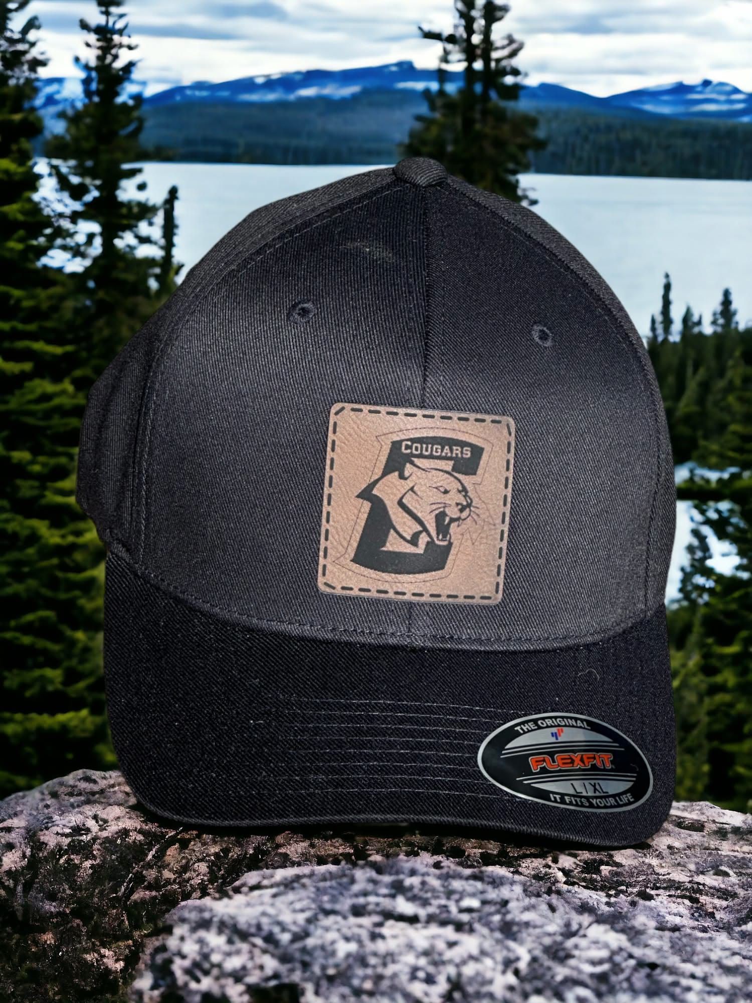 Black Flexfit hat with a square engraved leatherette Conestoga Cougars patch