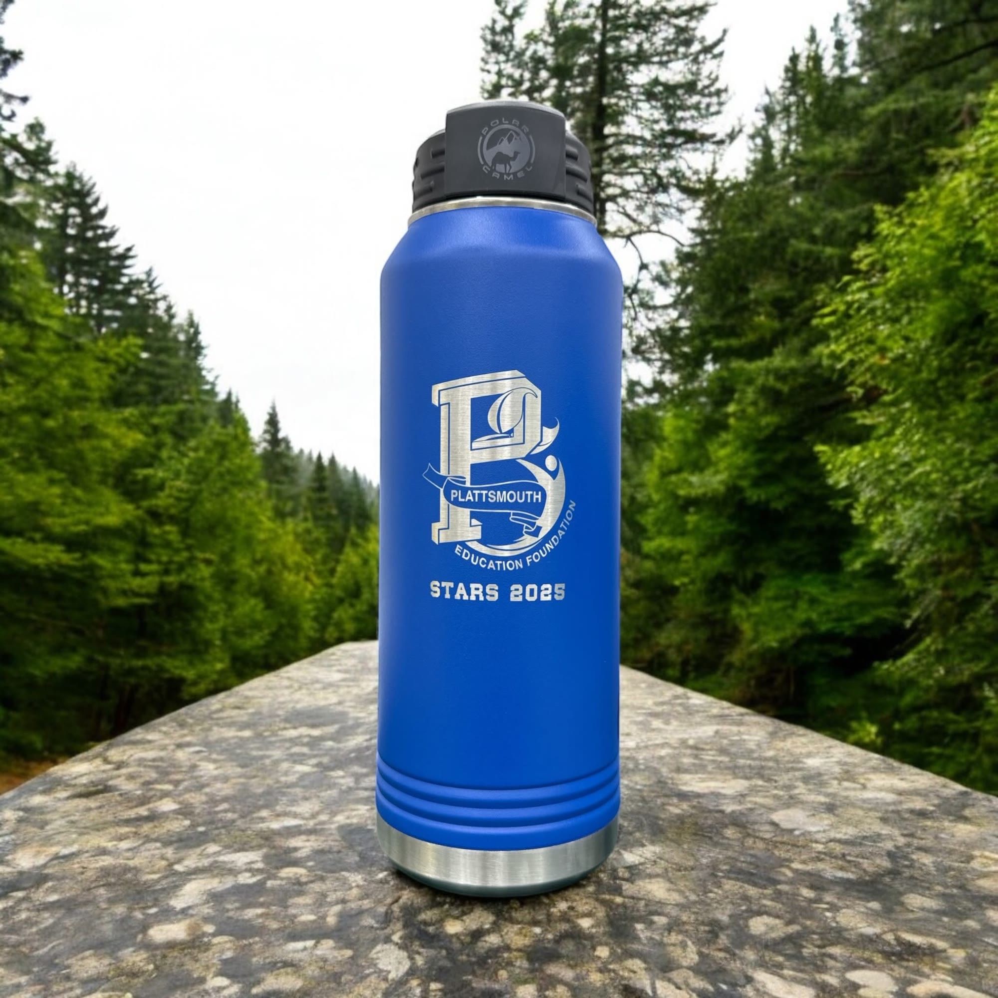 Blue water bottle engraved with the Plattsmouth Education Foundation Stars 2025 logo